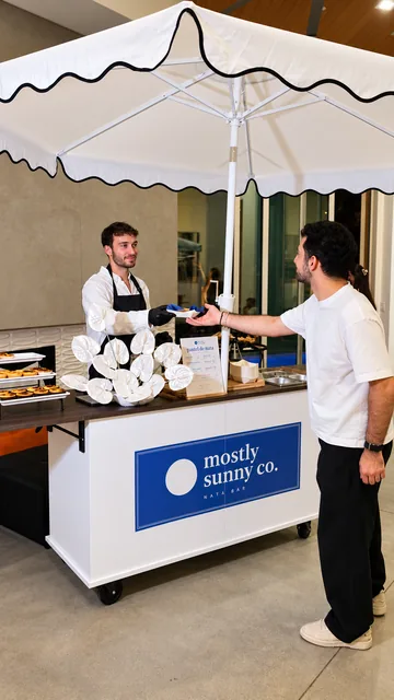 A Mostly Sunny Nata Bar serving a guest